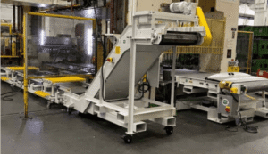 MPI turnkey scrap and parts handling at a stamping press: elevating conveyor on casters, shaker with walkover steps and a part-out conveyor
