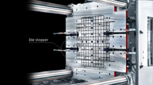 Pascal Die Stopper 1 Pascal Die Stoppers mounted on a mag clamp platen of an injection molding machine